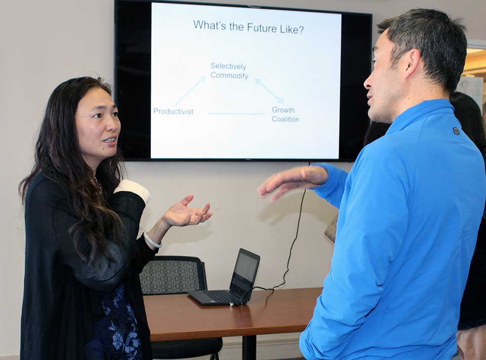 Xiulian Ma interacting with participant after her talk on Housing in China